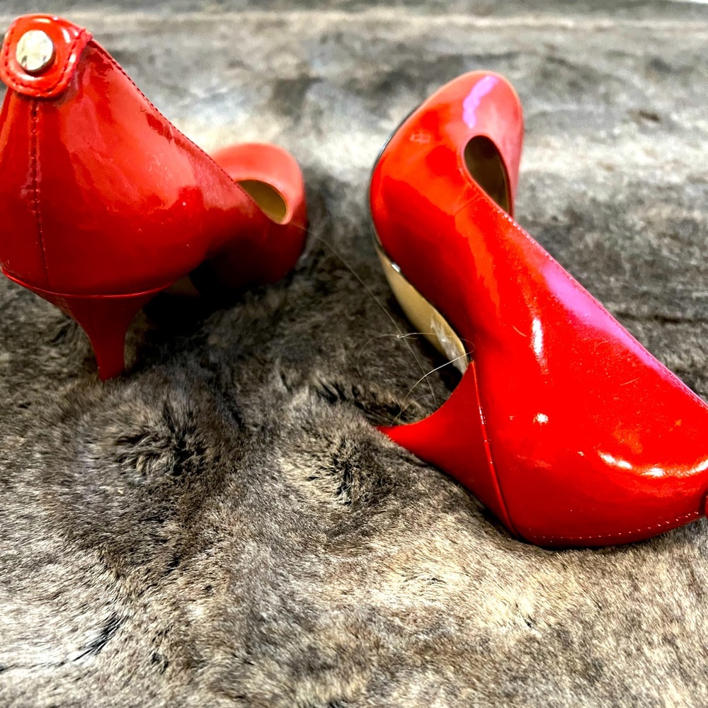 Michael Kors Red Heals size 7. Lightly worn